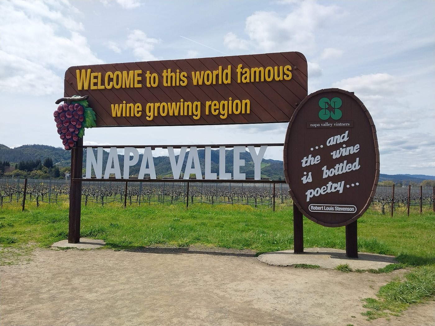 The Welcome to Napa Valley sign beside the vineyards
